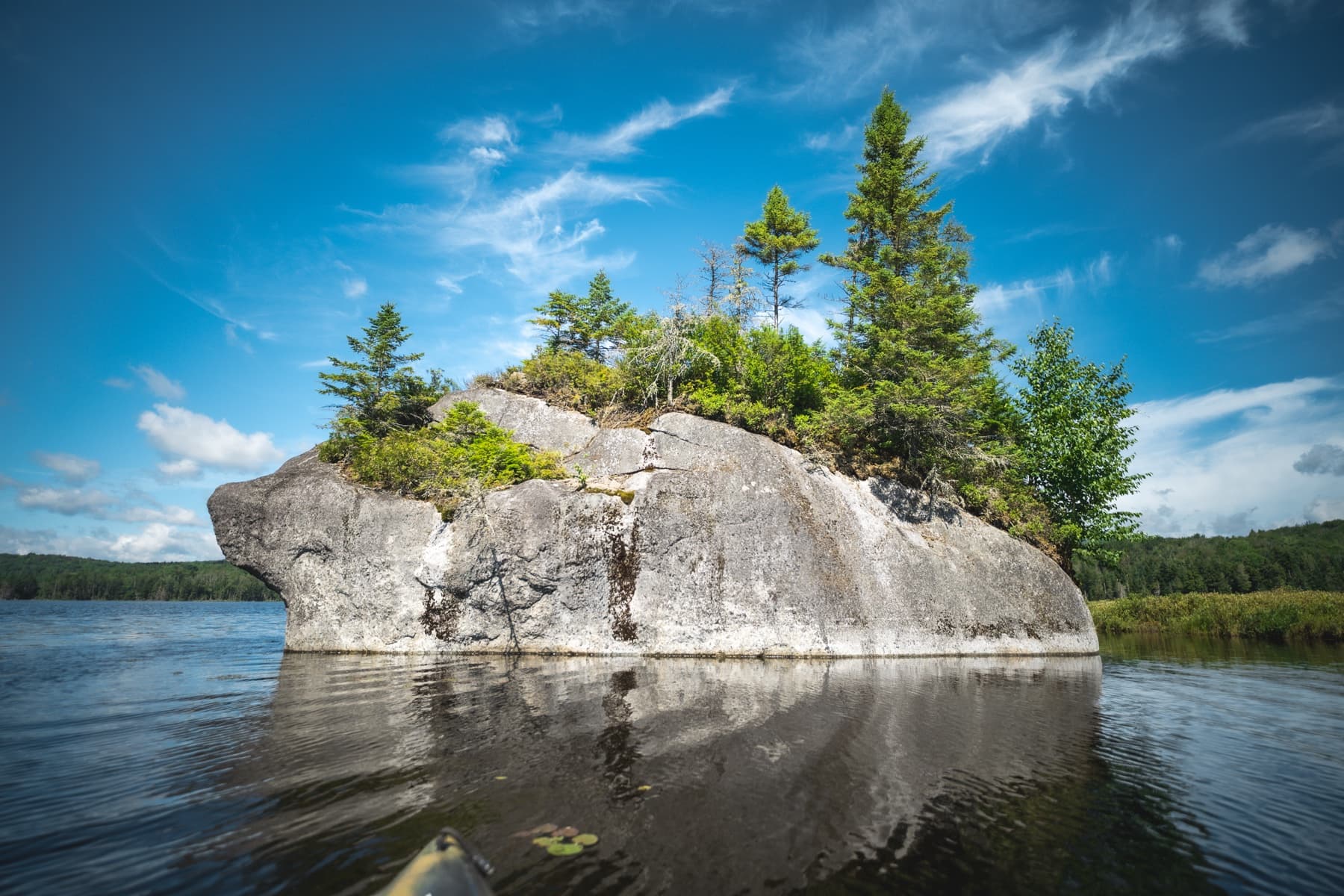 Illustration showing large glacial erratic boulders in an Adirondack forest